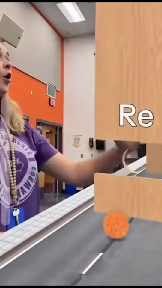 A player reacts as an augmented reality filter drops blocks down the screen