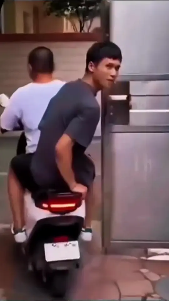 Riders pull away on a scooter as the claim about the food lands