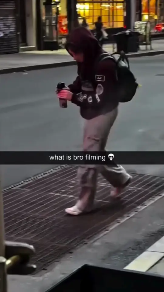 A camera on a long pole tracks a passer-by from an angle nobody expects